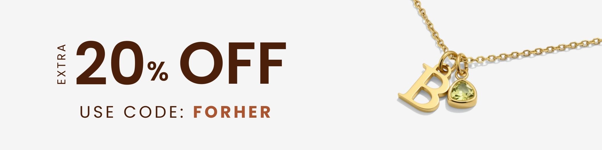 Gold necklace with charms and promotional text for 20% off on a light background