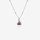 Silver Necklace with a red birthstone pendant on a white background