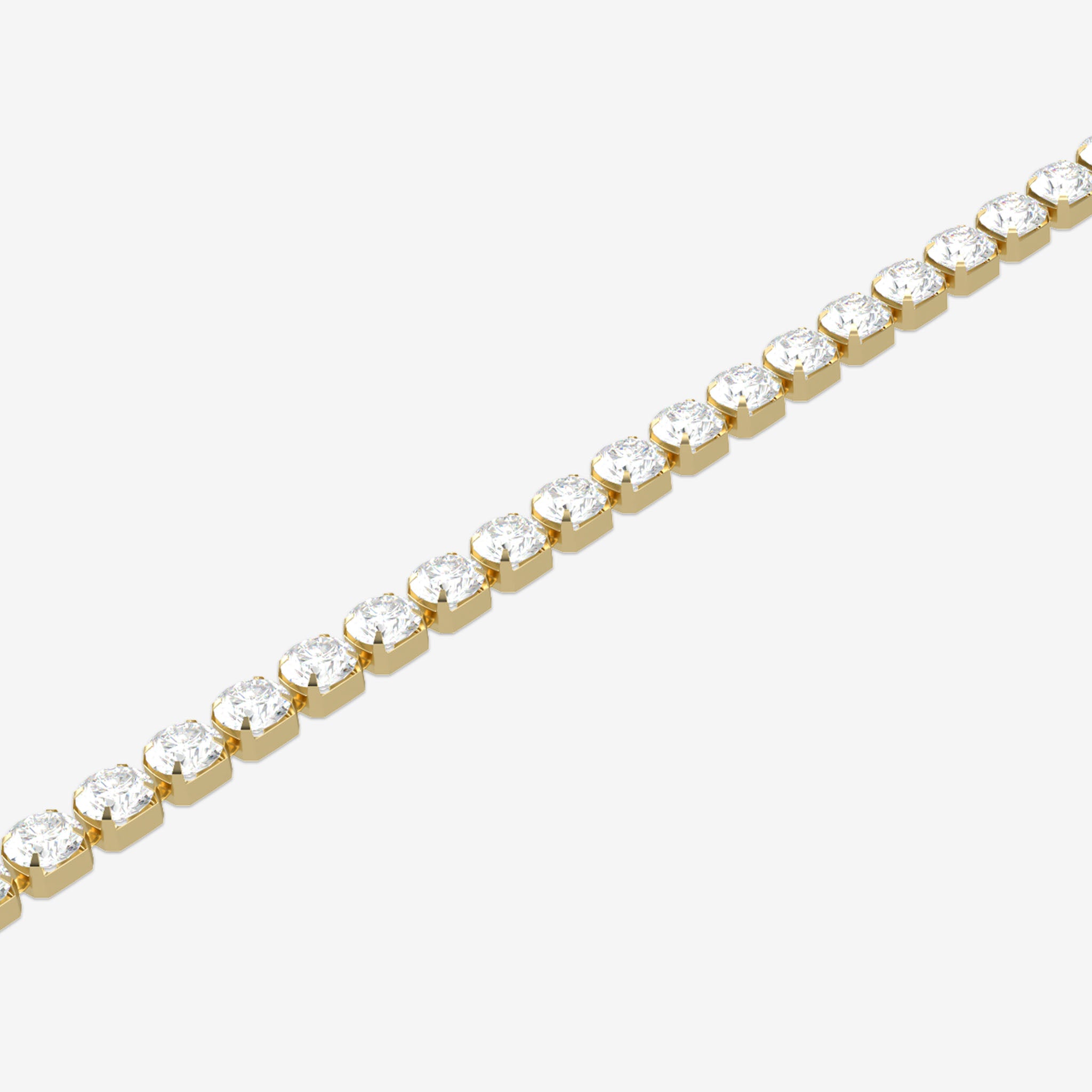 Gold bracelet with clear gemstones on a white background