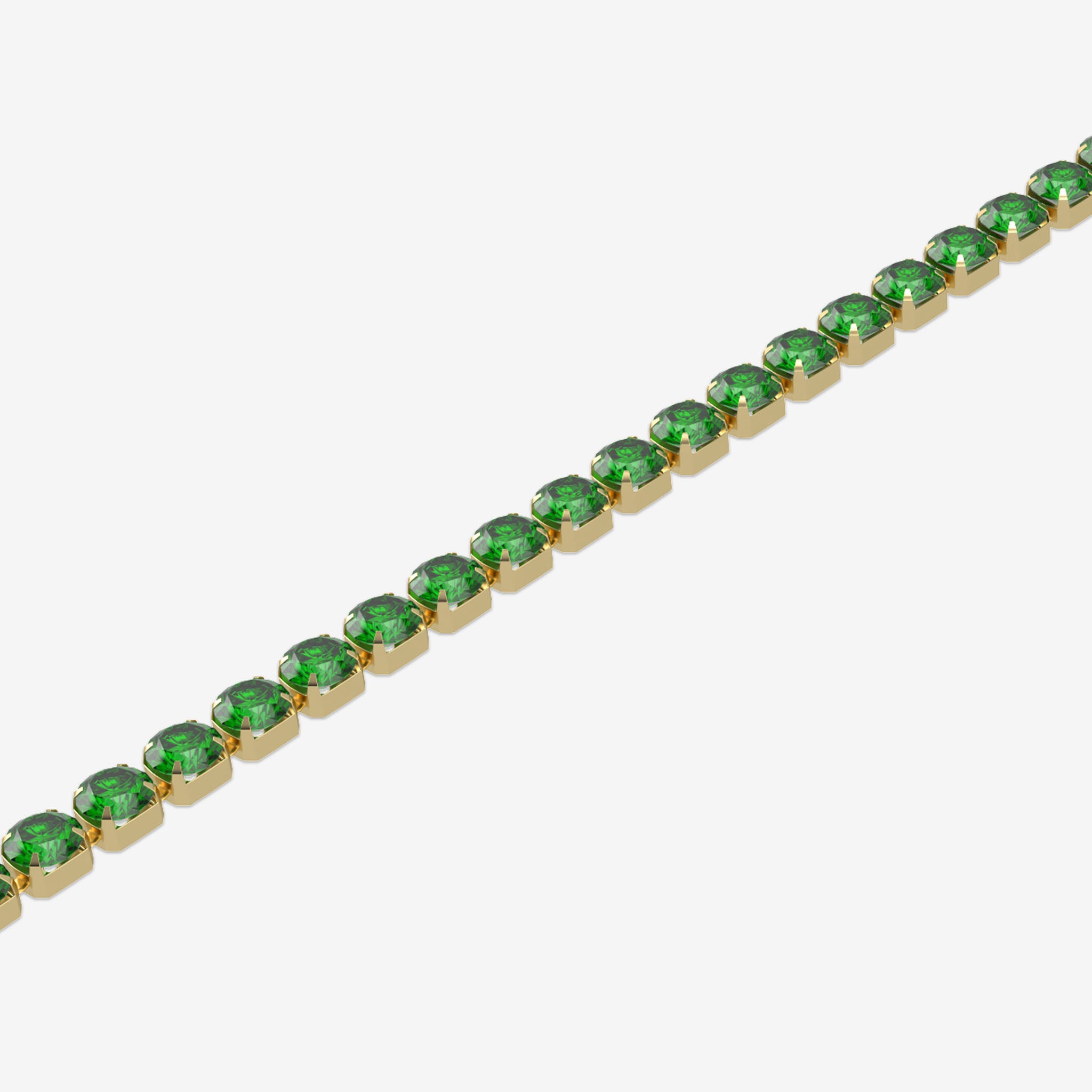 Gold bracelet with green gemstones on a white background