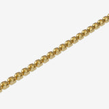 Gold beaded bracelet on a white background