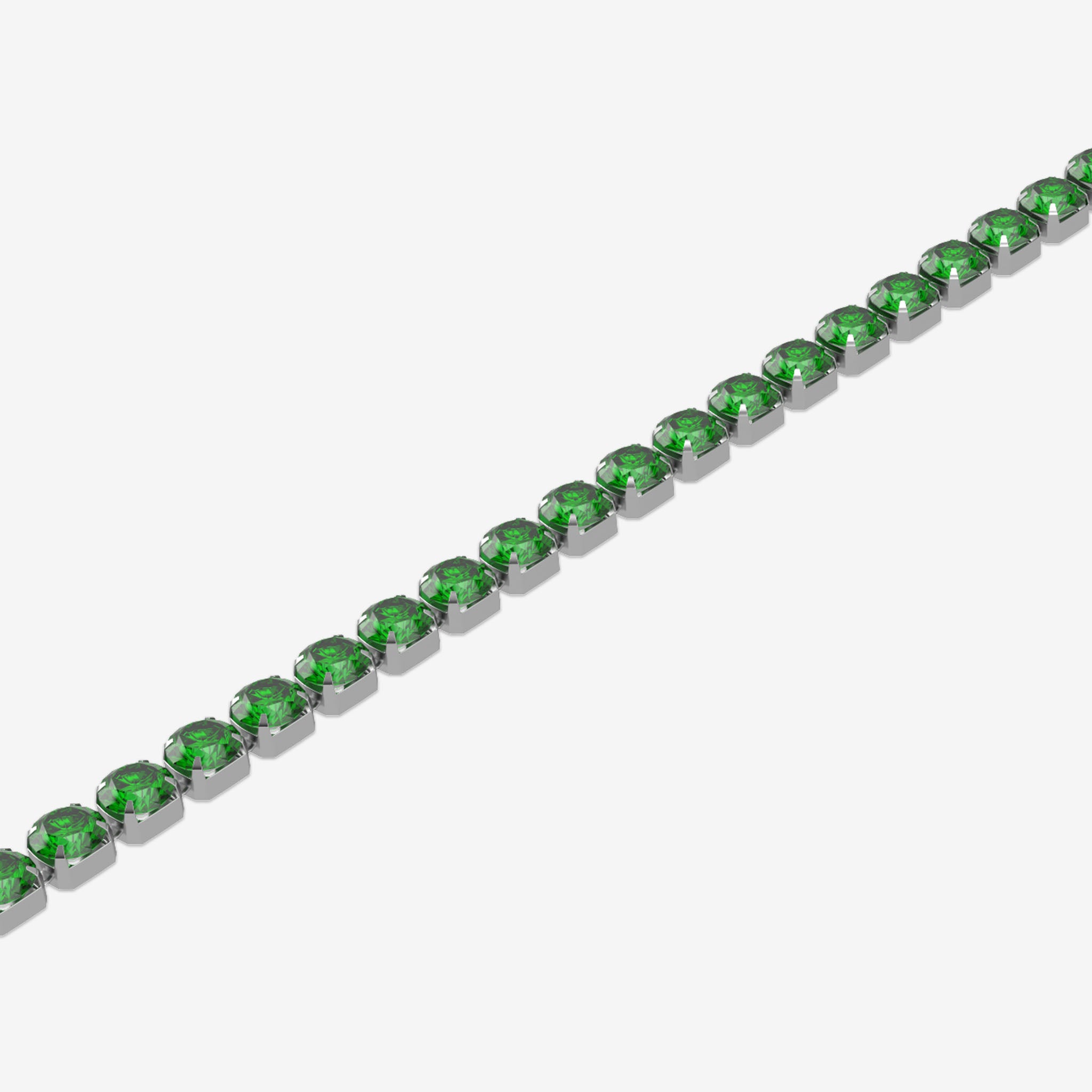 Green tennis gemstone bracelet in silver on a white background