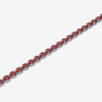 Bracelet with red gemstones on a white background