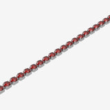 Bracelet with red gemstones on a white background