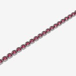 Bracelet with red gemstones on a white background