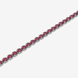 Bracelet with red gemstones on a white background