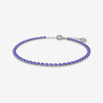 Purple birthstone tennis bracelet on a white background