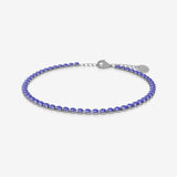 Purple birthstone tennis bracelet on a white background