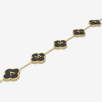 Gold clover necklace with black pendants and initials