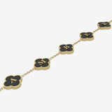 Gold clover necklace with black pendants and initials