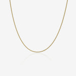Gold chain necklace on a white background