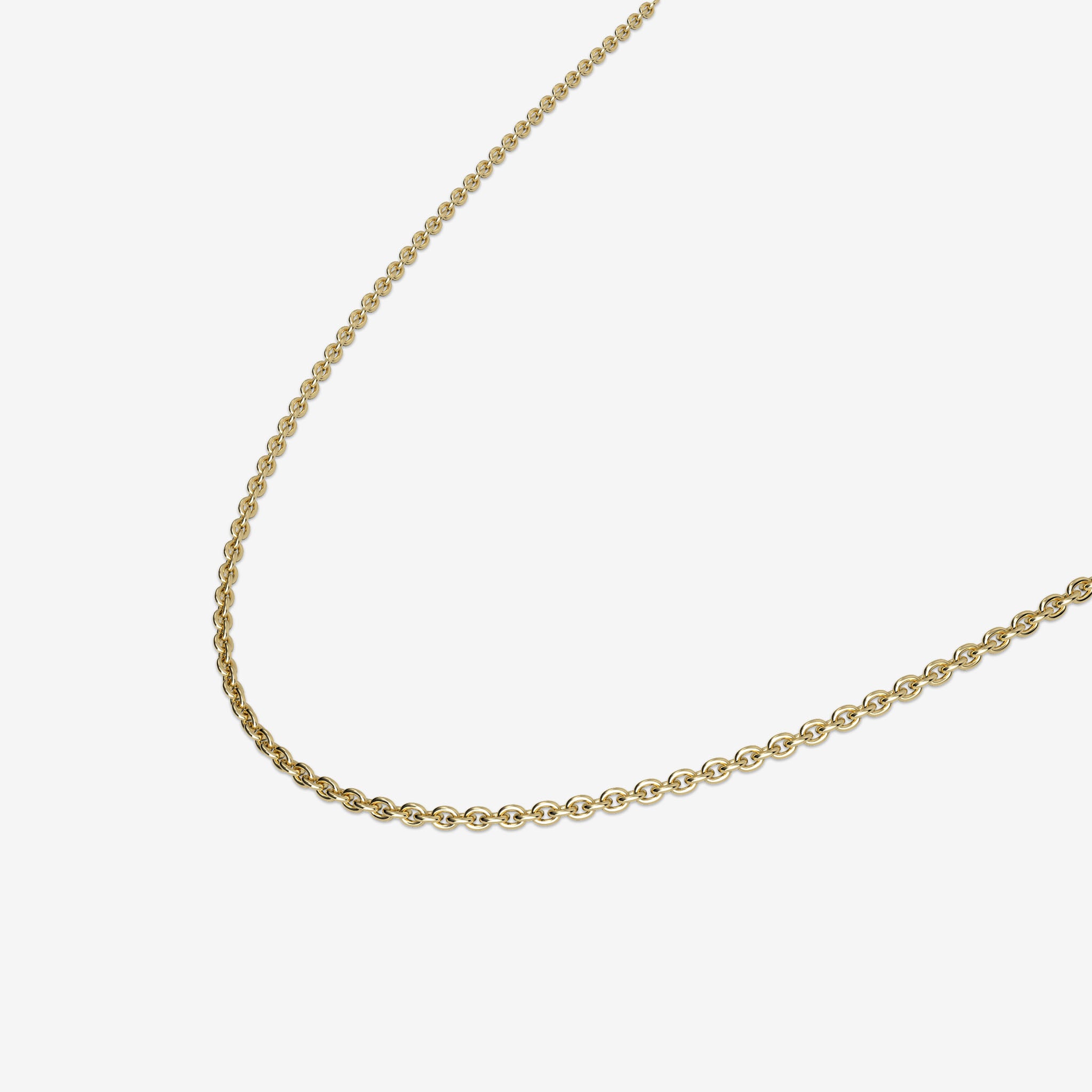 Gold chain necklace on a light beige background