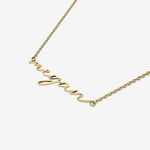 Gold name necklace with 'Megan' pendant on a white background