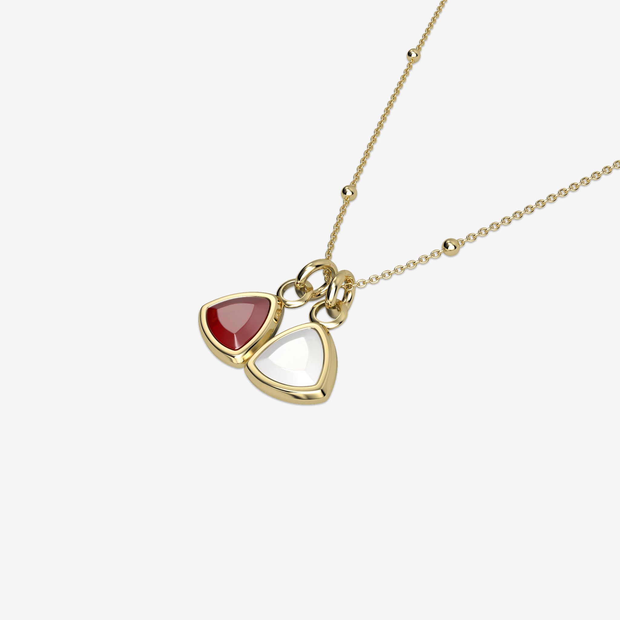 Gold necklace with triangle-shaped birthstone pendants on a white background