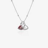 Silver necklace with 2 birthstone pendants on white background