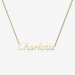 Gold necklace with 'Charlotte' pendant on a white background