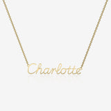 Gold necklace with 'Charlotte' pendant on a white background