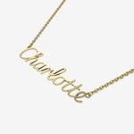 Gold necklace with 'Charlotte' pendant on a white background