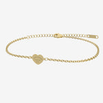 Gold bracelet with a heart-shaped tag with engraving on a white background