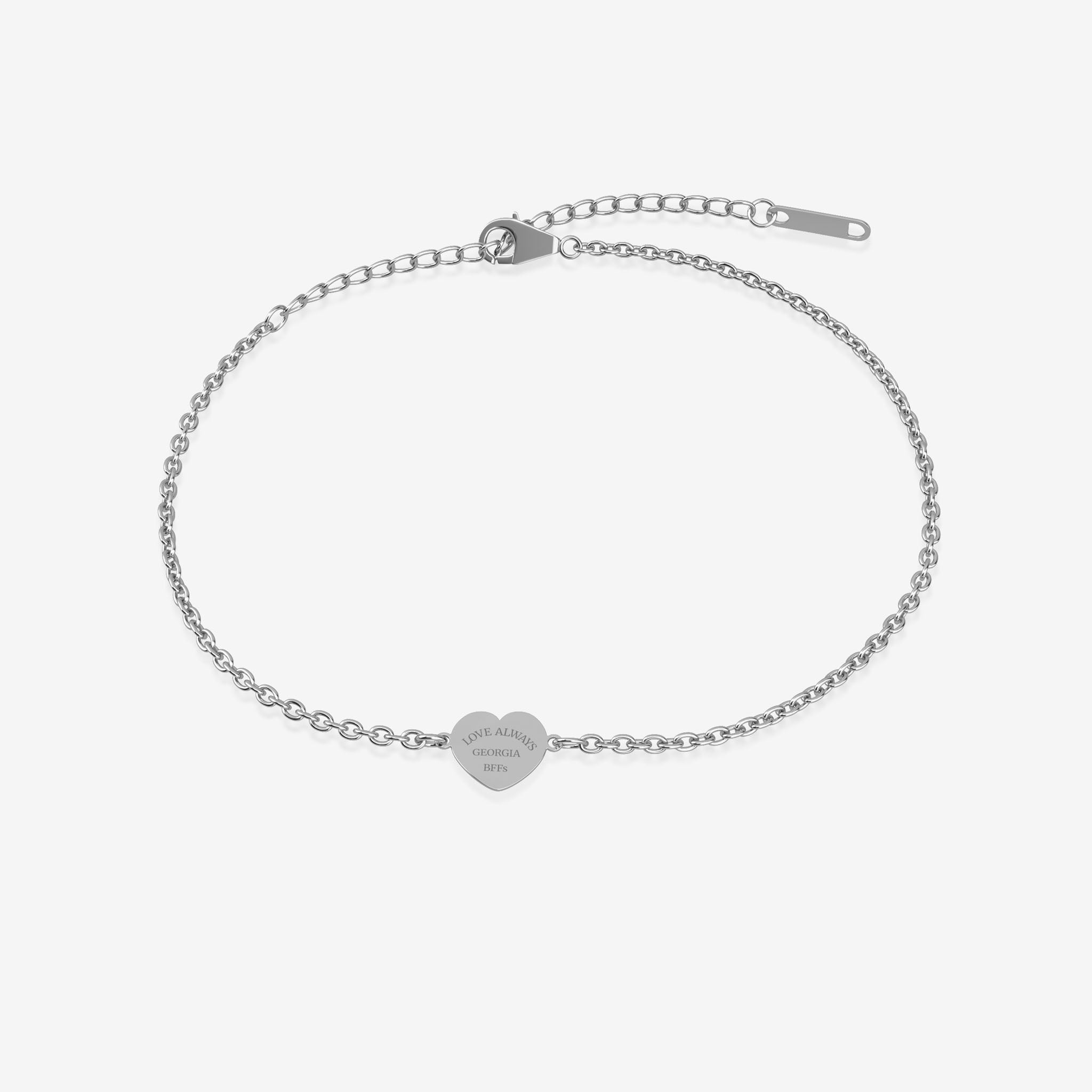 Silver bracelet with heart-shaped tag with engraving on a white background