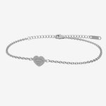 Silver bracelet with a heart-shaped tag with engraving on a white background