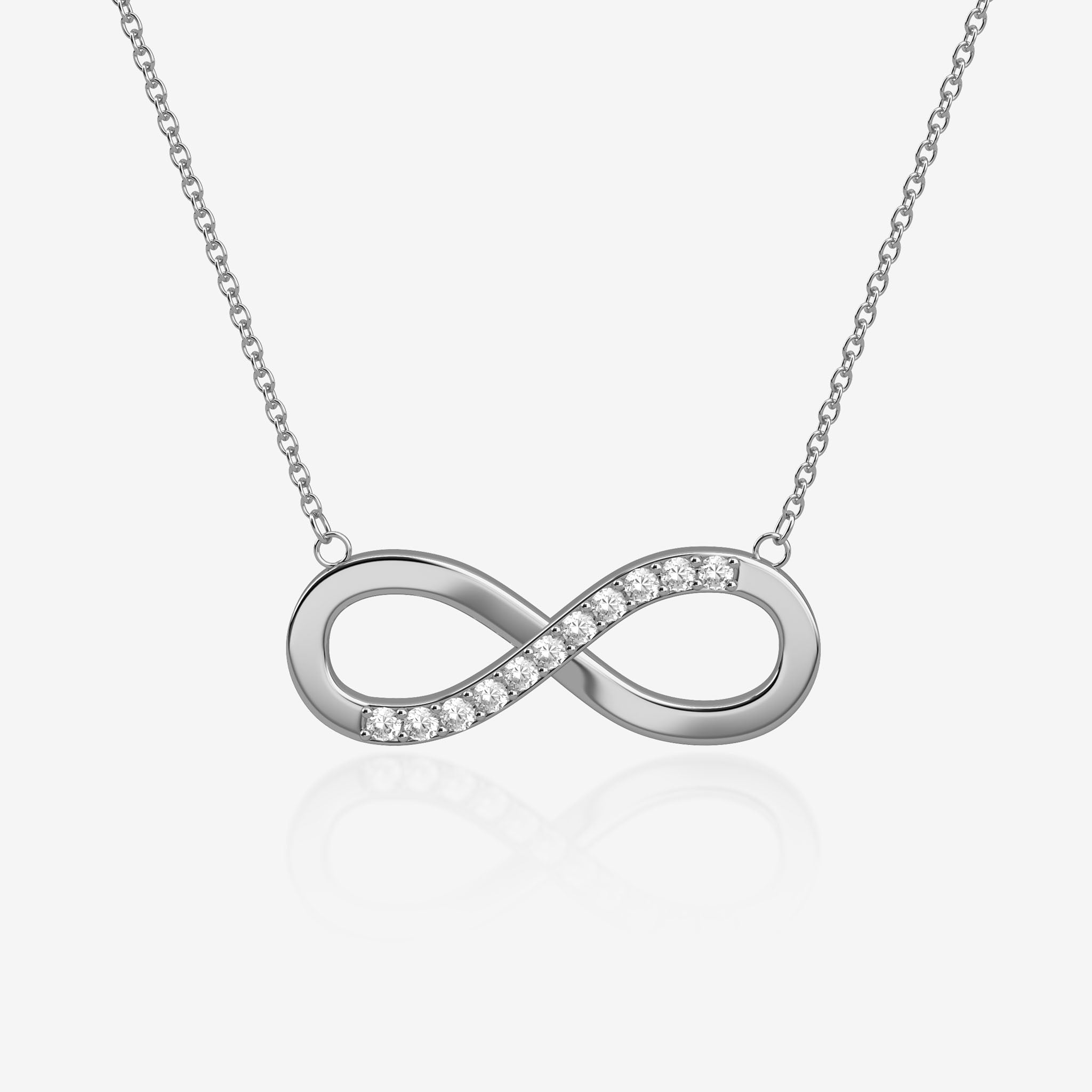 Silver infinity necklace with small diamonds on a light gray background
