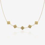 Gold clover necklace with name engraved on a white background
