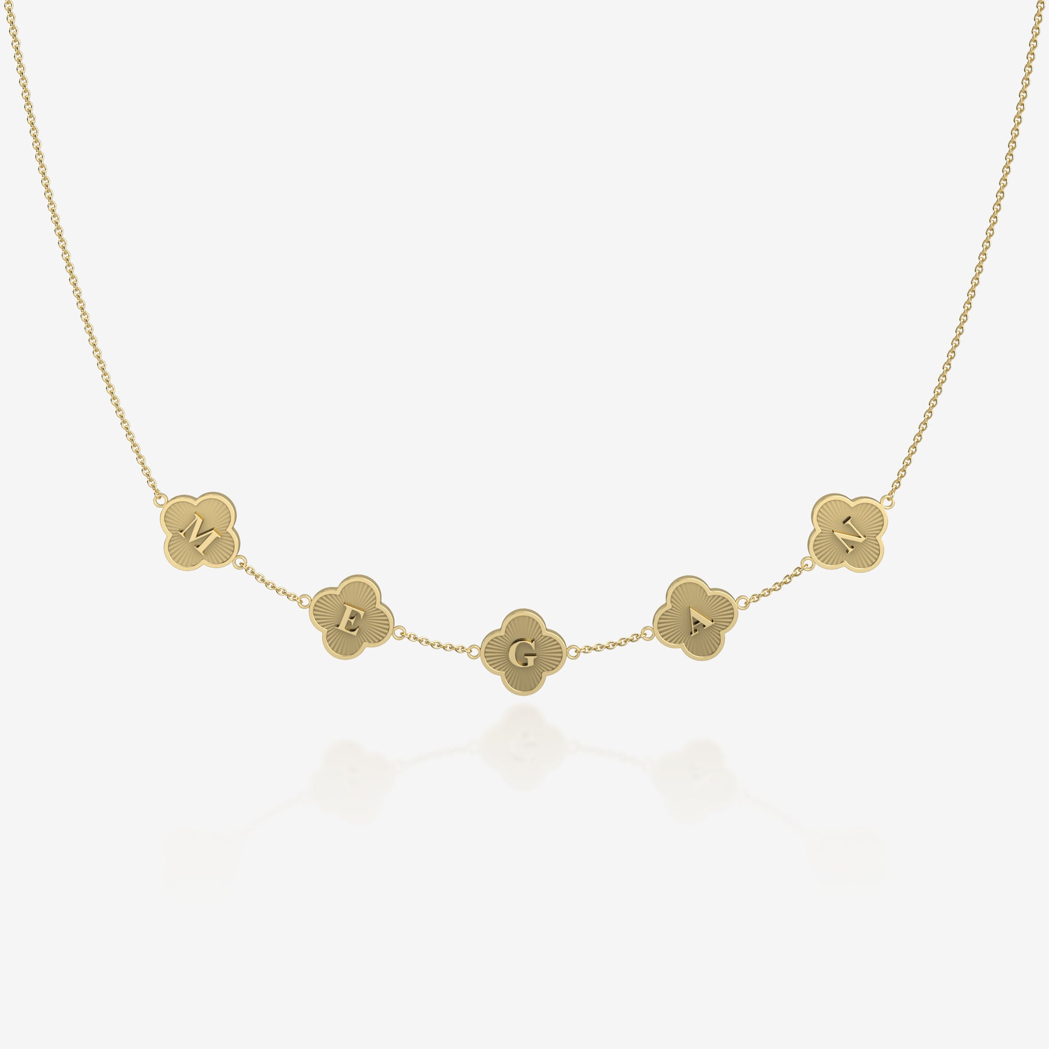 Gold clover necklace with name engraved on a white background
