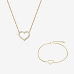 Gold heart-shaped necklace and bracelet on a white background