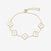 Gold bracelet with clover-shaped charms displays initials on a white background