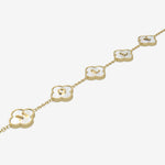 Gold bracelet with clover-shaped links on a white background