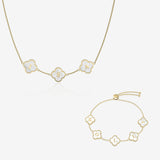 Gold and pearl clover name necklace and bracelet set on white background