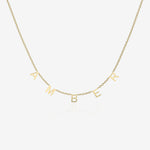 Gold necklace with 'AMBER' initial spread across the chain on a white background
