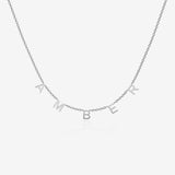 Silver necklace with 'AMBER' initials spread across the chain on a light gray background