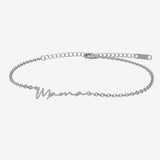 Silver bracelet with 'Mama' engraving on a white background