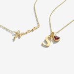 Two gold necklaces on a white background