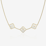 Gold necklace with clover-shaped pendants displaying letters on a white background