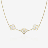 Gold necklace with clover-shaped pendants displaying letters on a white background