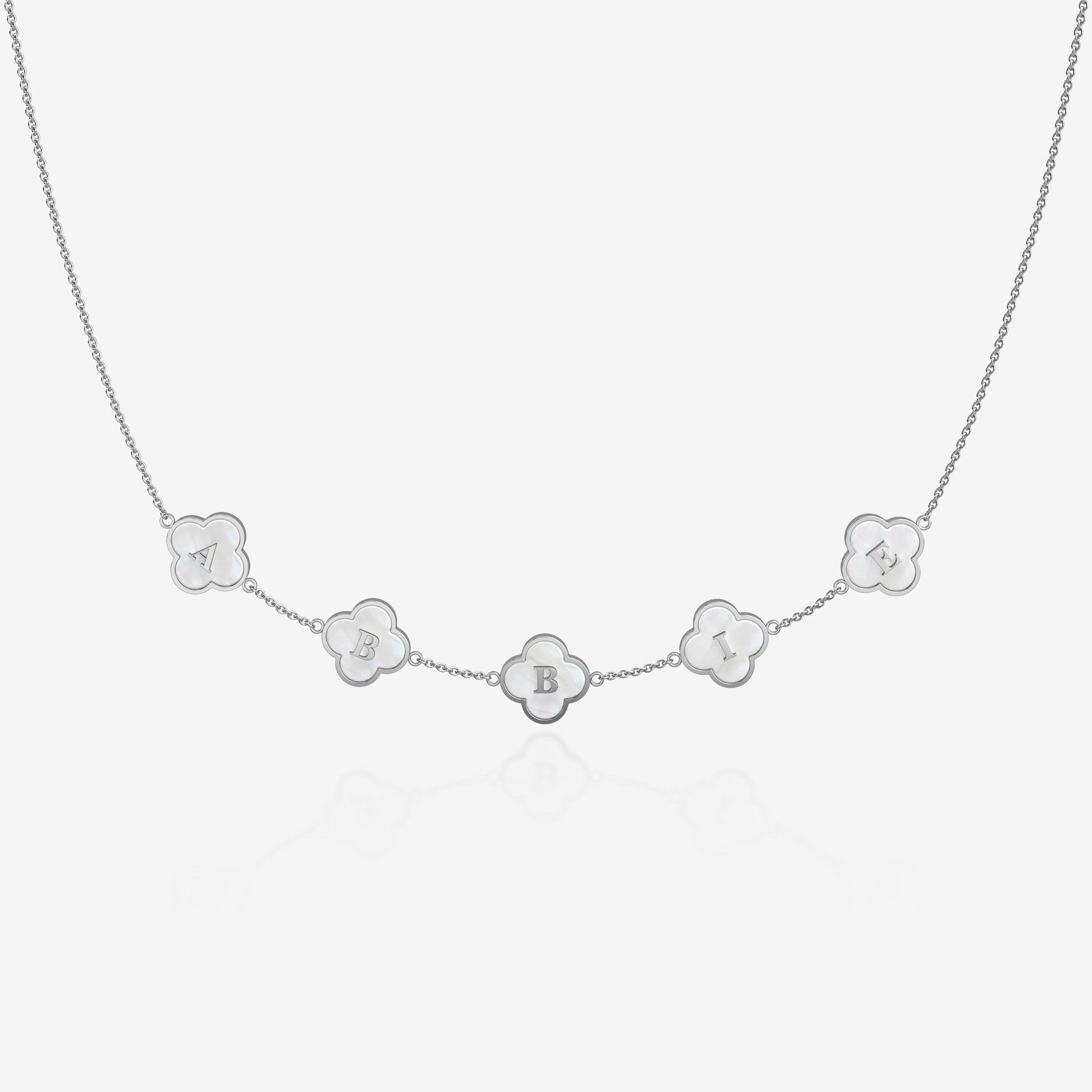 Silver Necklace with pearl clover-shaped pendants with initials on a white background