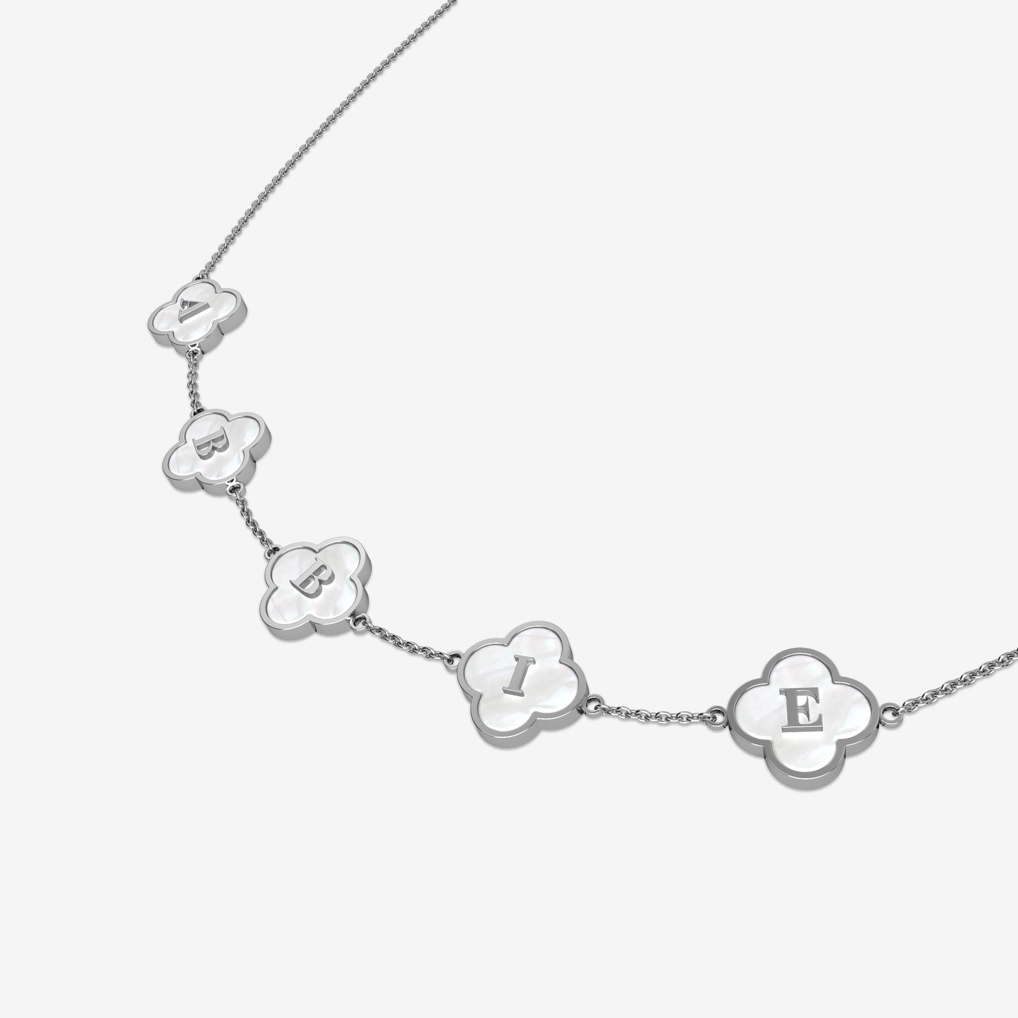 Silver necklace with clover-shaped charms displaying letters on a white background