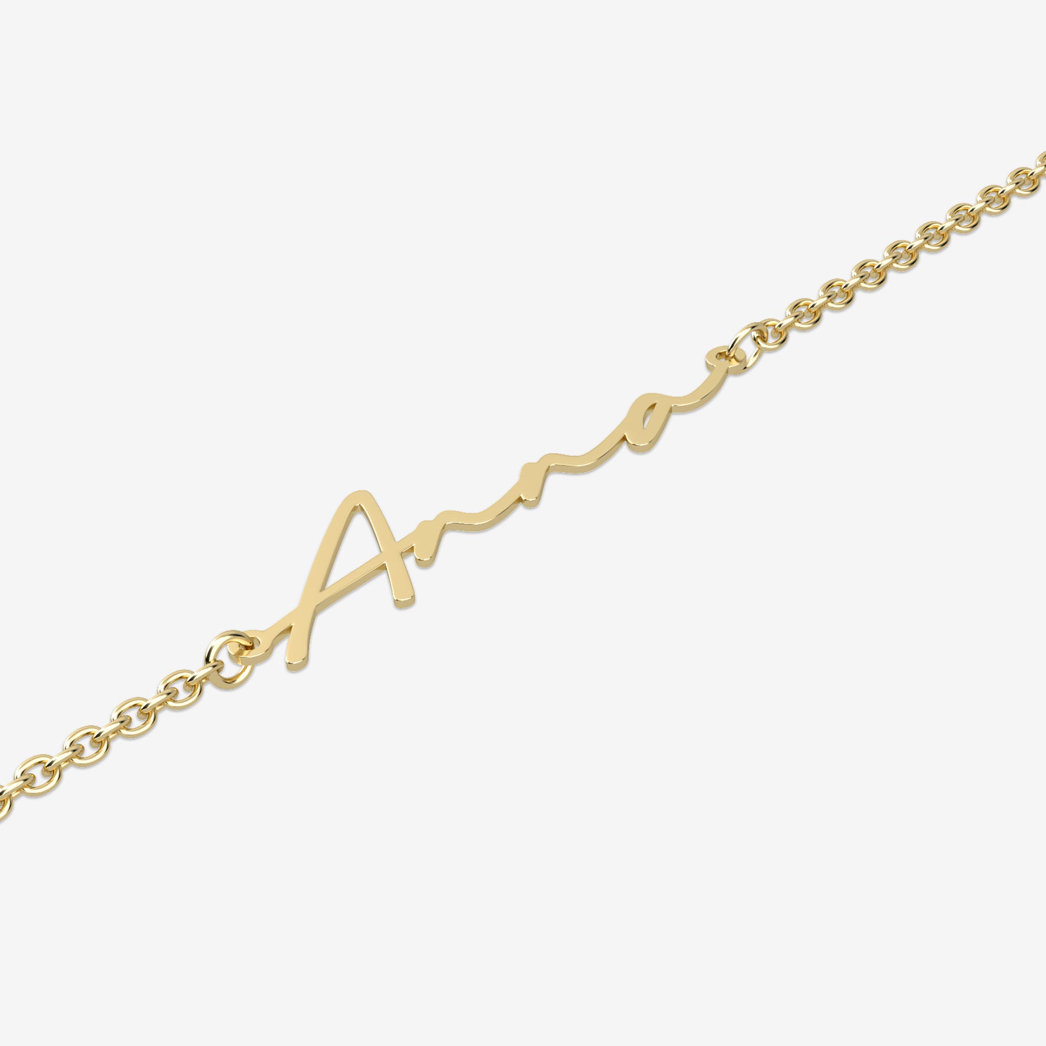 Gold name bracelet with a 'Anna' design on a white background