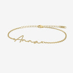 Gold name bracelet with 'Anna' engraved on a white background
