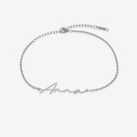 Silver name bracelet with 'Anna' engraving on a white background