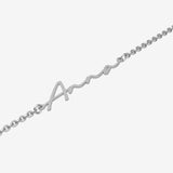Silver name bracelet with 'Anna' design on a white background