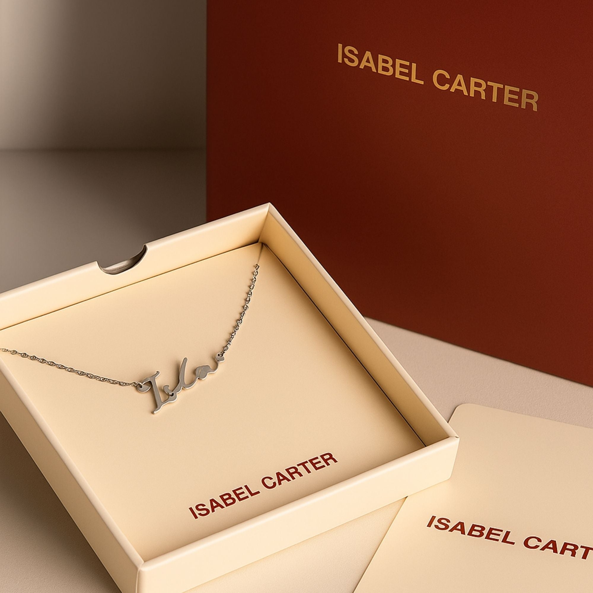 Personalised jewellery signature name necklace in silver with Isabel Carter packaging