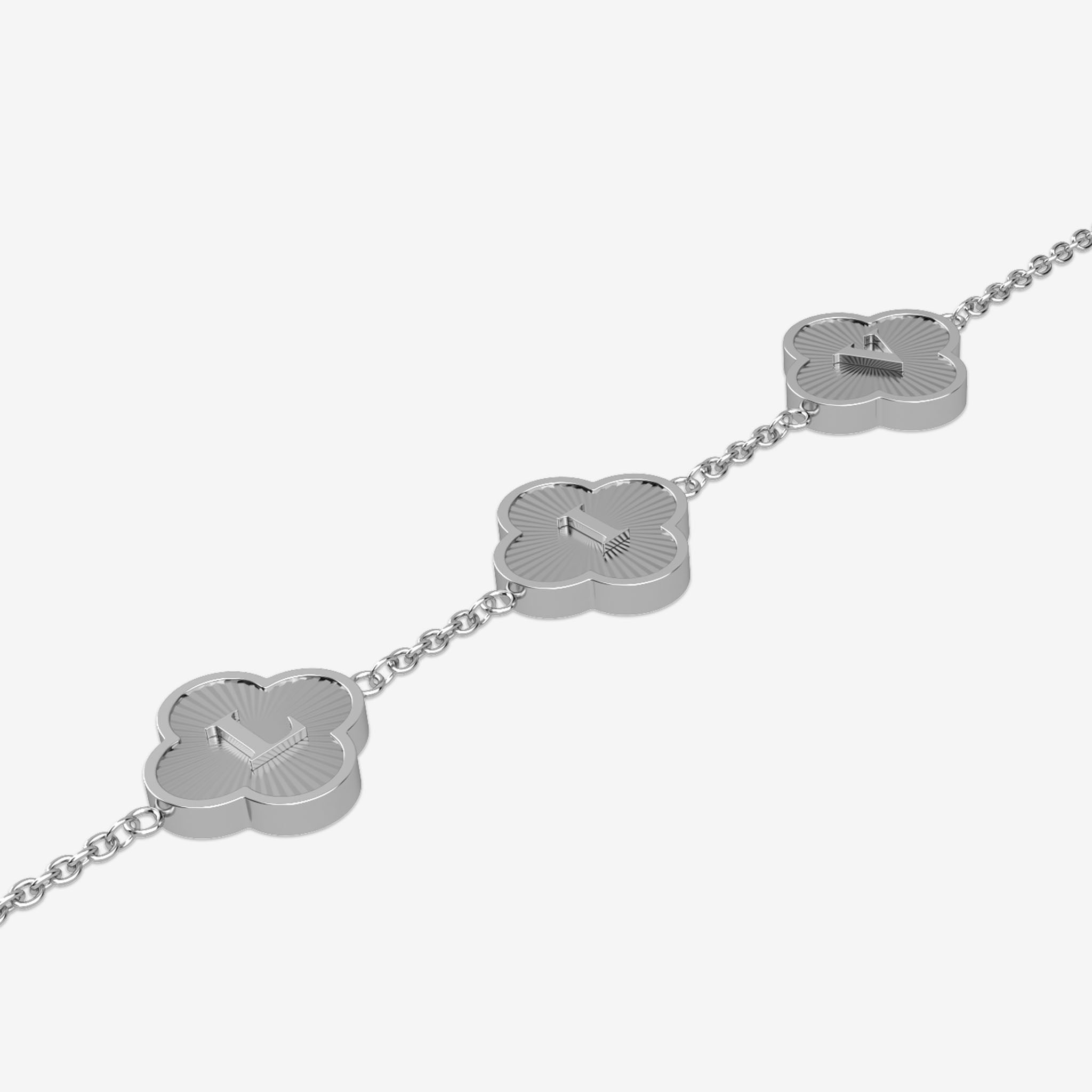 Silver bracelet with clover-shaped charms showing initials on a white background