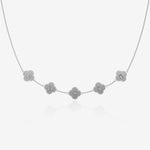 Silver clover necklace with engraved letters on a white background