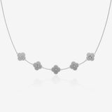 Silver clover necklace with engraved letters on a white background