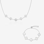 Silver and pearl clover name necklace and bracelet set on white background