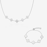 Silver and pearl clover name necklace and bracelet set on white background